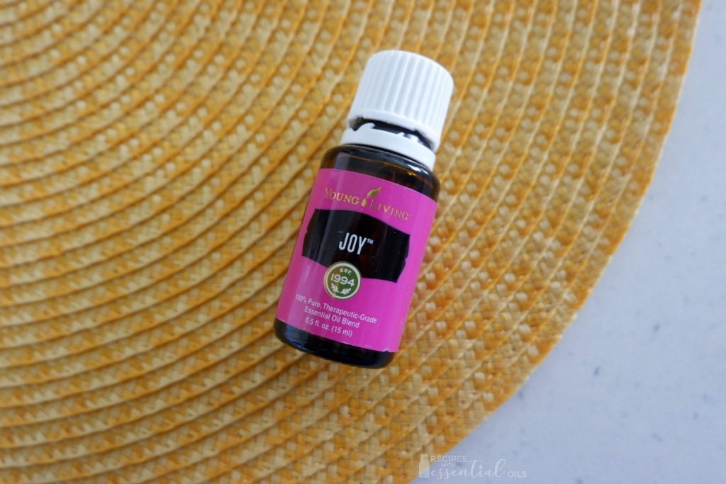 Joy essential oil blend on yellow background
